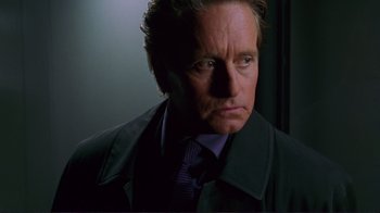 Movie still from “A Perfect Murder” (1998), directed by Andrew Davis – A person wearing a suit and tie; Close Up shot, Low angle