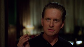 Movie still from “A Perfect Murder” (1998), directed by Andrew Davis – A person holding an apple; Close Up shot, Over the shoulder angle