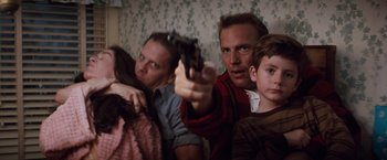 Movie still from “A Perfect World” (1993), directed by Clint Eastwood – A man holding a gun with two women and two boys; Medium shot, High angle
