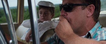 Movie still from “A Perfect World” (1993), directed by Clint Eastwood – A man and a boy in a car; Close Up shot, Low angle