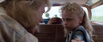 Movie still from “A Perfect World” (1993), directed by Clint Eastwood – A woman sitting next to a young boy in a car; Close Up shot, Over the shoulder angle
