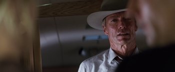 Movie still from “A Perfect World” (1993), directed by Clint Eastwood – An older man wearing a white hat and a white shirt; Close Up shot, Low angle