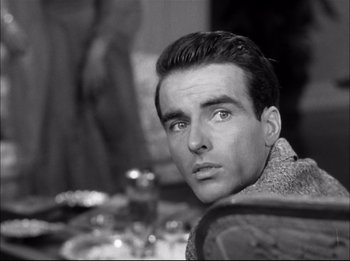 Movie still from “A Place in the Sun” (1951), directed by George Stevens – Black and white photograph of a man in a sweater; Close Up shot, Over the shoulder angle