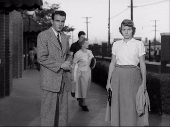 Movie still from “A Place in the Sun” (1951), directed by George Stevens – A black and white photo of a man and a woman; Medium shot, Low angle