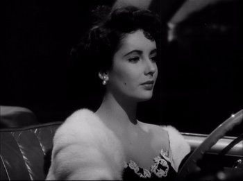 Movie still from “A Place in the Sun” (1951), directed by George Stevens – A black and white photo of a woman in a car; Close Up shot, Low angle