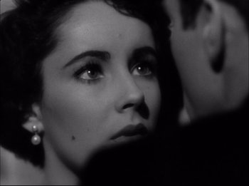 Movie still from “A Place in the Sun” (1951), directed by George Stevens – A black - and - white photo of a woman's face; Close Up shot, Over the shoulder angle