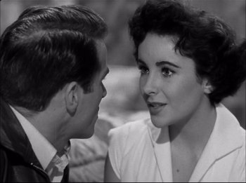 Movie still from “A Place in the Sun” (1951), directed by George Stevens – A man and a woman talking to each other; Close Up shot, Over the shoulder angle
