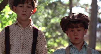 Movie still from “A River Runs Through It” (1992), directed by Robert Redford – Two young boys wearing cowboy hats and suspenders; Close Up shot, Low angle