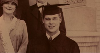 Movie still from “A River Runs Through It” (1992), directed by Robert Redford – An old photo of a man in a graduation gown; Extreme Close Up shot, Overhead angle