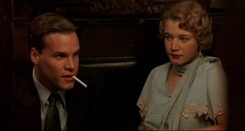 Movie still from “A River Runs Through It” (1992), directed by Robert Redford – A man and a woman sitting next to each other; Close Up shot, Over the shoulder angle