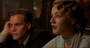 Movie still from “A River Runs Through It” (1992), directed by Robert Redford – A man and a woman sitting next to each other; Close Up shot, Over the shoulder angle