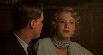 Movie still from “A River Runs Through It” (1992), directed by Robert Redford – A man and a woman looking at one another in a mirror; Close Up shot, Over the shoulder angle