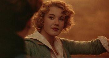 Movie still from “A River Runs Through It” (1992), directed by Robert Redford – A person with curly hair; Close Up shot, Over the shoulder angle