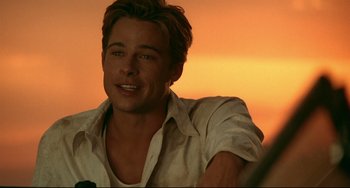 Movie still from “A River Runs Through It” (1992), directed by Robert Redford – A person sitting in a chair; Close Up shot, Over the shoulder angle