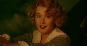 A person with curly red hair