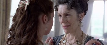 Movie still from “A Royal Affair” (2012), directed by Nikolaj Arcel – An older woman and a younger woman looking at each other; Close Up shot, Over the shoulder angle