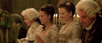 Movie still from “A Royal Affair” (2012), directed by Nikolaj Arcel – A group of women standing next to each other in a room; Medium shot, Over the shoulder angle