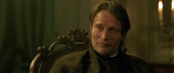 Movie still from “A Royal Affair” (2012), directed by Nikolaj Arcel – Mads mikkelsen sitting in a chair; Close Up shot, Over the shoulder angle