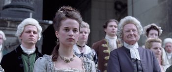 Movie still from “A Royal Affair” (2012), directed by Nikolaj Arcel – A group of people dressed in period clothing; Close Up shot, Low angle