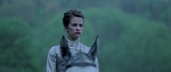 Movie still from “A Royal Affair” (2012), directed by Nikolaj Arcel – A woman in a white dress standing next to a horse; Close Up shot, Over the shoulder angle