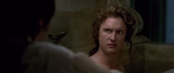 Movie still from “A Royal Affair” (2012), directed by Nikolaj Arcel – A person in a room looking at the camera; Close Up shot, Over the shoulder angle