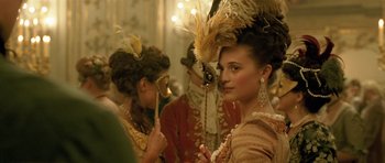 Movie still from “A Royal Affair” (2012), directed by Nikolaj Arcel – A group of people dressed in period costumes; Close Up shot, Over the shoulder angle