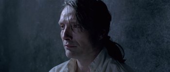 Movie still from “A Royal Affair” (2012), directed by Nikolaj Arcel – A person with long hair; Close Up shot, Over the shoulder angle