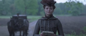 Movie still from “A Royal Affair” (2012), directed by Nikolaj Arcel – A woman in a victorian dress holding a box of money; Close Up shot, Low angle