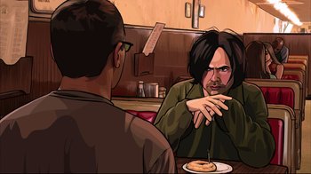 Movie still from “A Scanner Darkly” (2006), directed by Richard Linklater – A man sitting at a table with another man in front of him; Medium shot, Over the shoulder angle