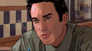 Movie still from “A Scanner Darkly” (2006), directed by Richard Linklater – A man with green eyes is looking at the camera; Close Up shot, High angle
