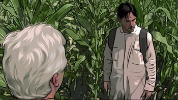 Movie still from “A Scanner Darkly” (2006), directed by Richard Linklater – A man in a field of corn talking to a man in an older man; Close Up shot, Over the shoulder angle