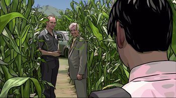 Movie still from “A Scanner Darkly” (2006), directed by Richard Linklater – Two men are standing in a corn field talking to another man; Medium shot, High angle