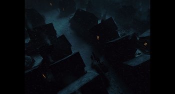 Movie still from “A Serious Man” (2009), directed by Joel Coen – An aerial view of a dark city at night; Extreme Wide shot, High angle