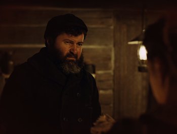 Movie still from “A Serious Man” (2009), directed by Joel Coen – A man with a beard is looking into a mirror; Close Up shot, Over the shoulder angle