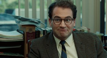 Movie still from “A Serious Man” (2009), directed by Joel Coen – A man in a suit and tie with a frowning look on his face; Close Up shot, Low angle