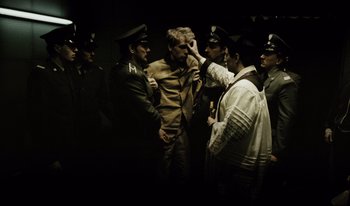 Movie still from “A Short Film About Killing” (1988), directed by Krzysztof Kieslowski – A group of men standing next to each other; Medium shot, Over the shoulder angle