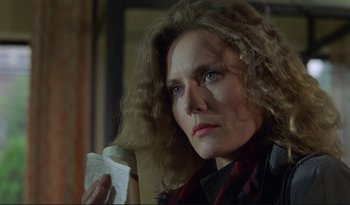 Movie still from “A Short Film About Love” (1988), directed by Krzysztof Kieslowski – A person holding a piece of paper; Close Up shot, Low angle