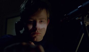 Movie still from “A Short Film About Love” (1988), directed by Krzysztof Kieslowski – A young man is looking into the camera; Close Up shot, Low angle