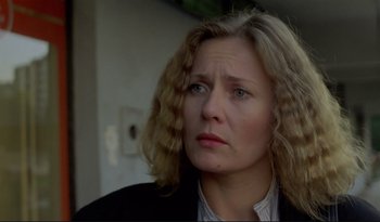 Movie still from “A Short Film About Love” (1988), directed by Krzysztof Kieslowski – A person with curly hair; Close Up shot, Low angle