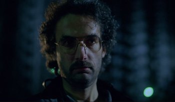 Movie still from “A Short Film About Love” (1988), directed by Krzysztof Kieslowski – A person wearing glasses; Close Up shot, Low angle