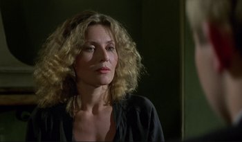 Movie still from “A Short Film About Love” (1988), directed by Krzysztof Kieslowski – A person wearing a black shirt; Close Up shot, Over the shoulder angle