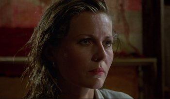 Movie still from “A Short Film About Love” (1988), directed by Krzysztof Kieslowski – A person looking at the camera; Close Up shot, Low angle