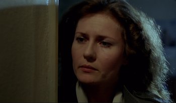 Movie still from “A Short Film About Love” (1988), directed by Krzysztof Kieslowski – A person looking at the camera; Close Up shot, Over the shoulder angle