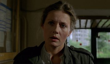 Movie still from “A Short Film About Love” (1988), directed by Krzysztof Kieslowski – A person wearing a jacket; Close Up shot, Low angle