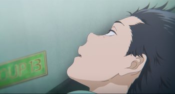 Movie still from “A Silent Voice: The Movie” (2016), directed by Taichi Ishidate – An animated picture of a man with his eyes closed; Extreme Close Up shot, Overhead angle
