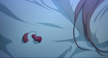Movie still from “A Silent Voice: The Movie” (2016), directed by Taichi Ishidate – A video game controller sitting on top of a table; Extreme Close Up shot, Overhead angle