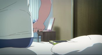 Movie still from “A Silent Voice: The Movie” (2016), directed by Taichi Ishidate – A person holding a hand on a bed with a cell phone; Extreme Close Up shot, Over the shoulder angle