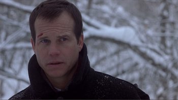 Movie still from “A Simple Plan” (1998), directed by Sam Raimi – A person wearing a black jacket; Close Up shot, Low angle