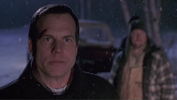 Movie still from “A Simple Plan” (1998), directed by Sam Raimi – A man with a bandage on his face and a man with a bandage on his head; Close Up shot, Low angle