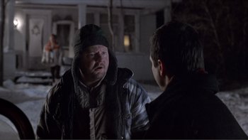 Movie still from “A Simple Plan” (1998), directed by Sam Raimi – A man and a boy are talking in the dark; Medium shot, Over the shoulder angle